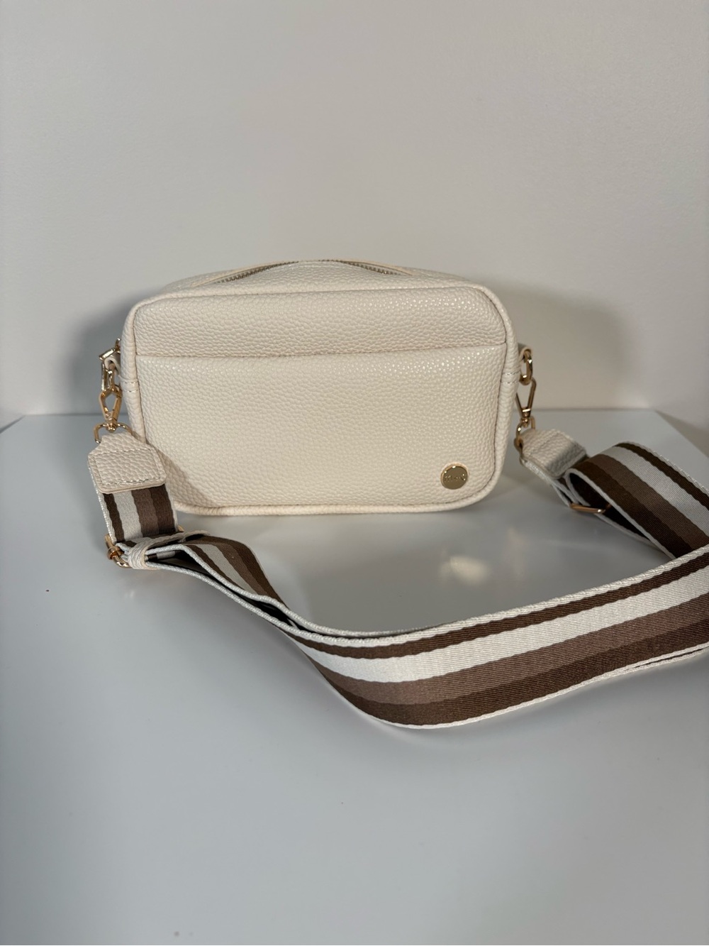 Cream Textured Crossbody Bag with Brown Striped Strap